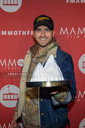 Ryan Rottman receiving award on behalf