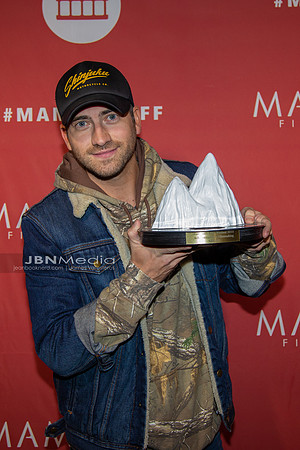 Ryan Rottman receiving award on behalf