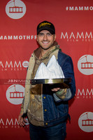 Ryan Rottman receiving award on behalf