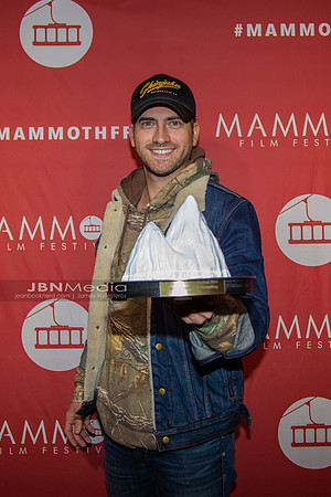 Ryan Rottman receiving award on behalf