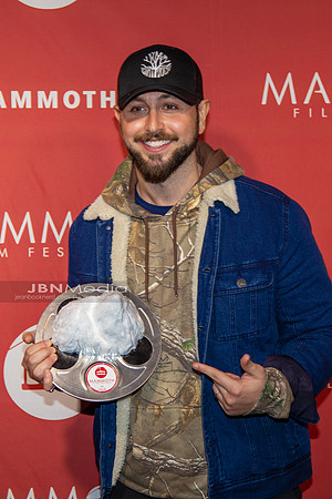 Paul Khoury receiving award on behalf